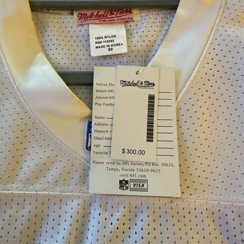 Mitchell & Ness White Jersey with Green and Orange Accents. Brand new with tags